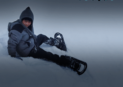 boy laying in snow with upper text saying "retired from sad, new career in business Mitski" the image is meant to imitate that album of Mitski